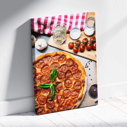 Canvas wall art featuring a high-resolution pepperoni pizza with basil and cooking ingredients decor.