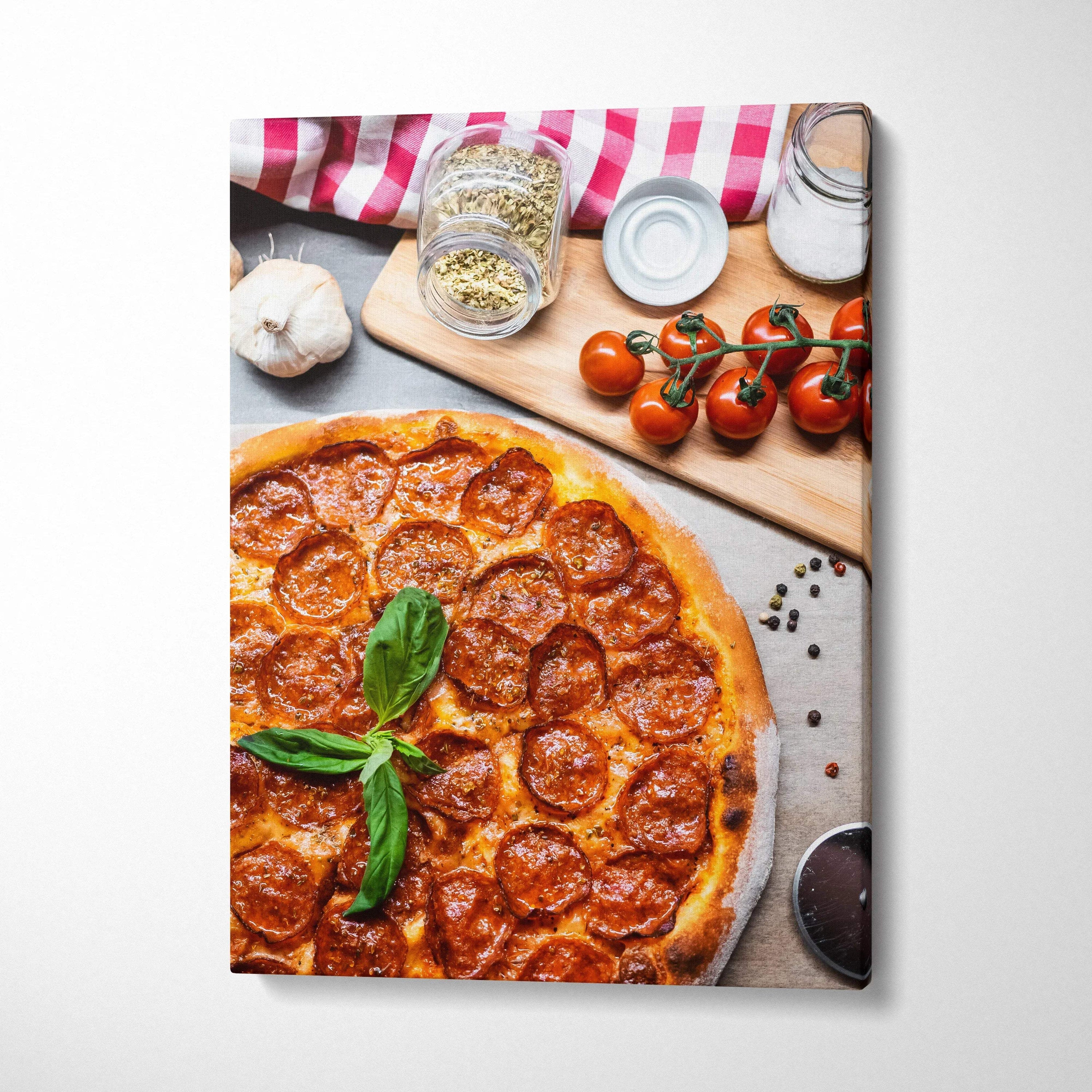 Vertical canvas wall art featuring a high-resolution pepperoni pizza with fresh basil and kitchen decor elements.
