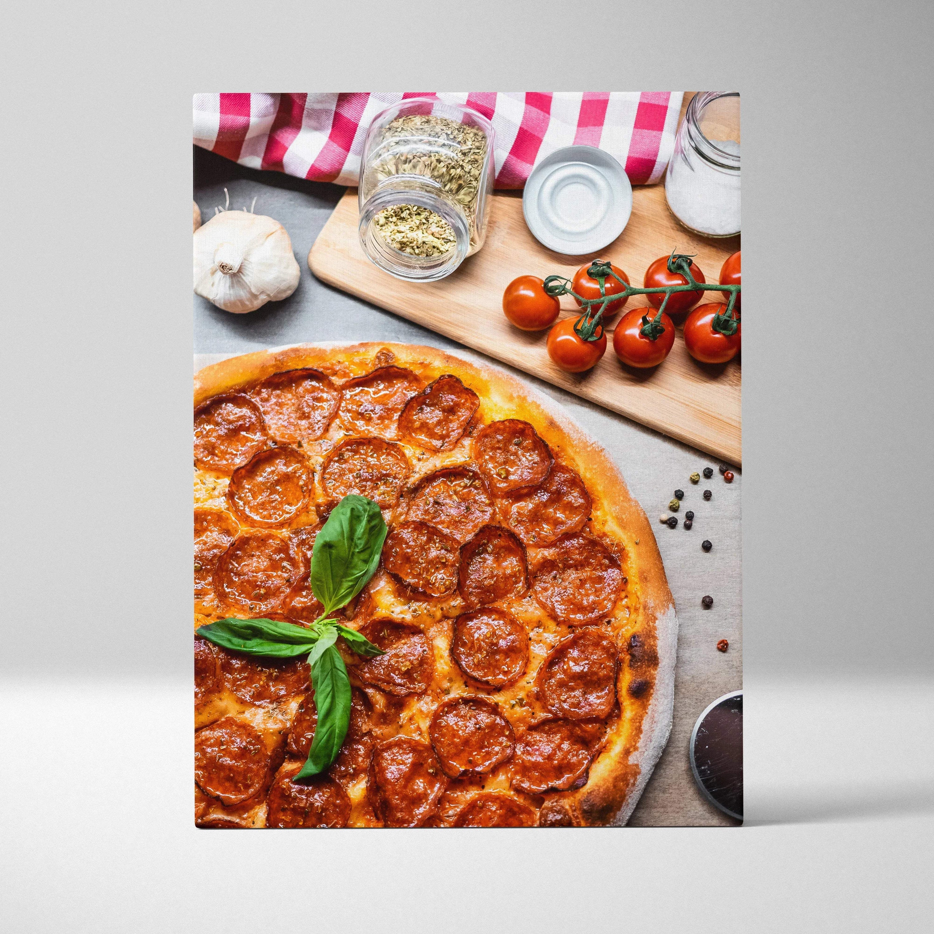 Canvas wall art featuring a high-resolution, close-up of pepperoni pizza with fresh basil and kitchen ingredients decor.
