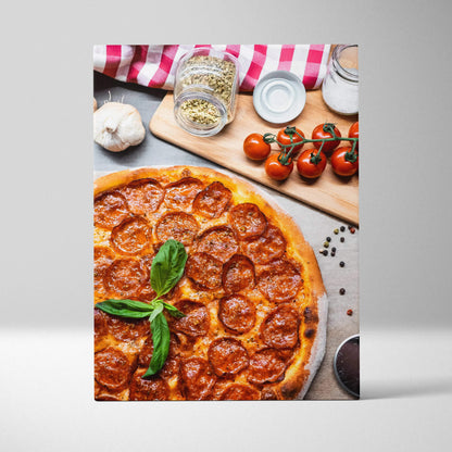 Canvas wall art featuring a high-resolution, close-up of pepperoni pizza with fresh basil and kitchen ingredients decor.