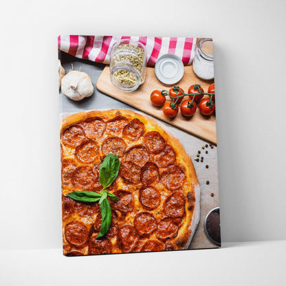 Pizza-themed canvas wall art featuring a pepperoni pizza with fresh basil on a wooden table, perfect kitchen decor.
