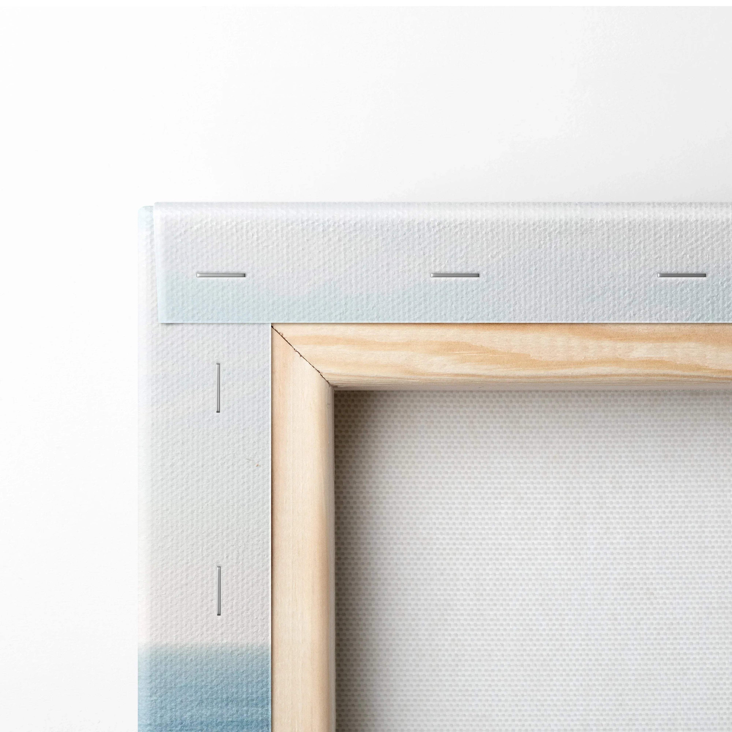 Close-up of corner of stretched white canvas on a wooden frame for wall art or canvas art.