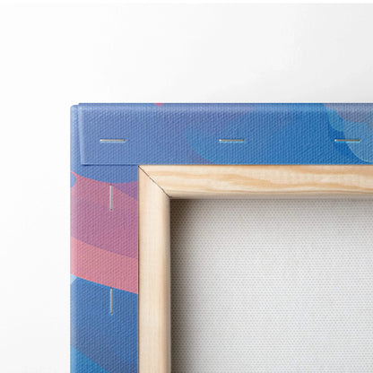 Close-up of wooden frame edge with stretched canvas featuring blue and pink abstract floral design on wall art decor.