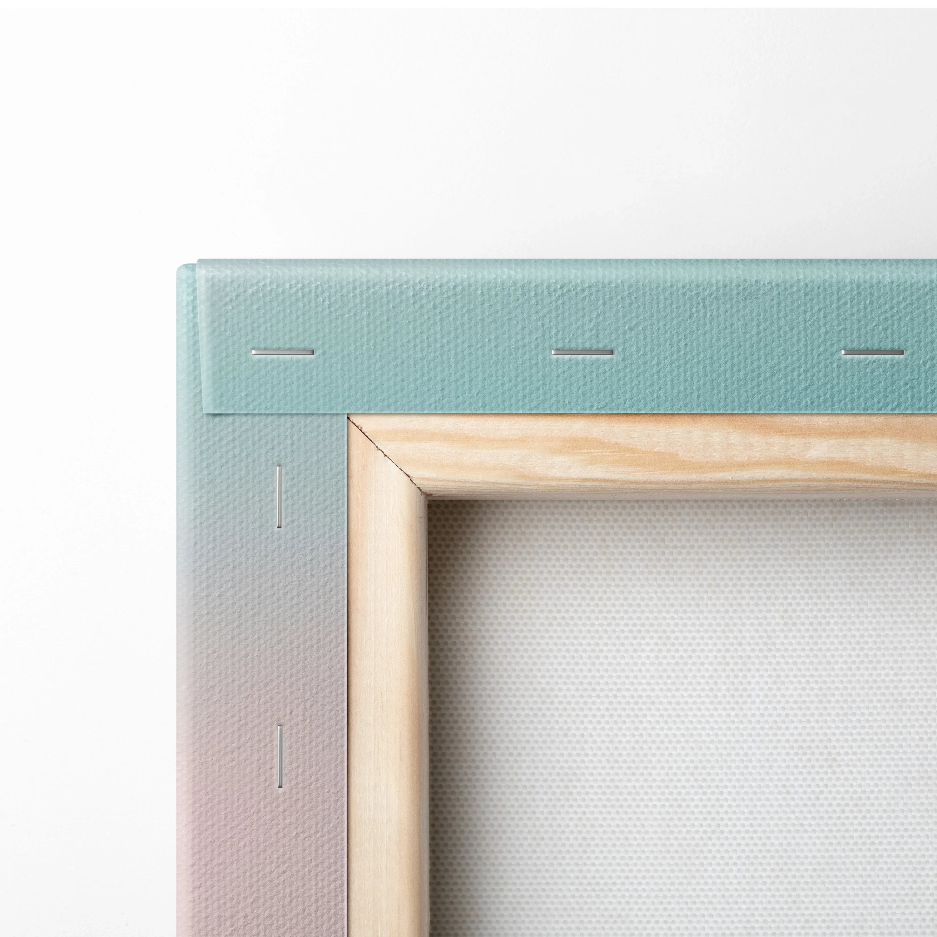 Close-up of stretched canvas with wooden frame and gradient pastel colors for wall art decor.