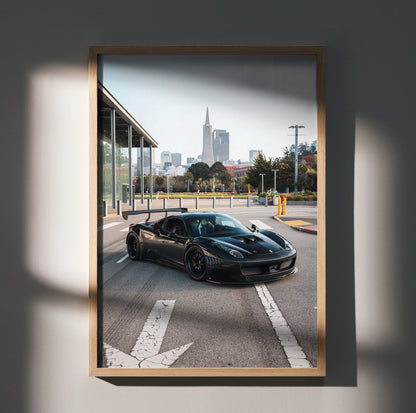 Ferrari 458 Italia GT3 black race car on city street poster wall art in wooden frame.