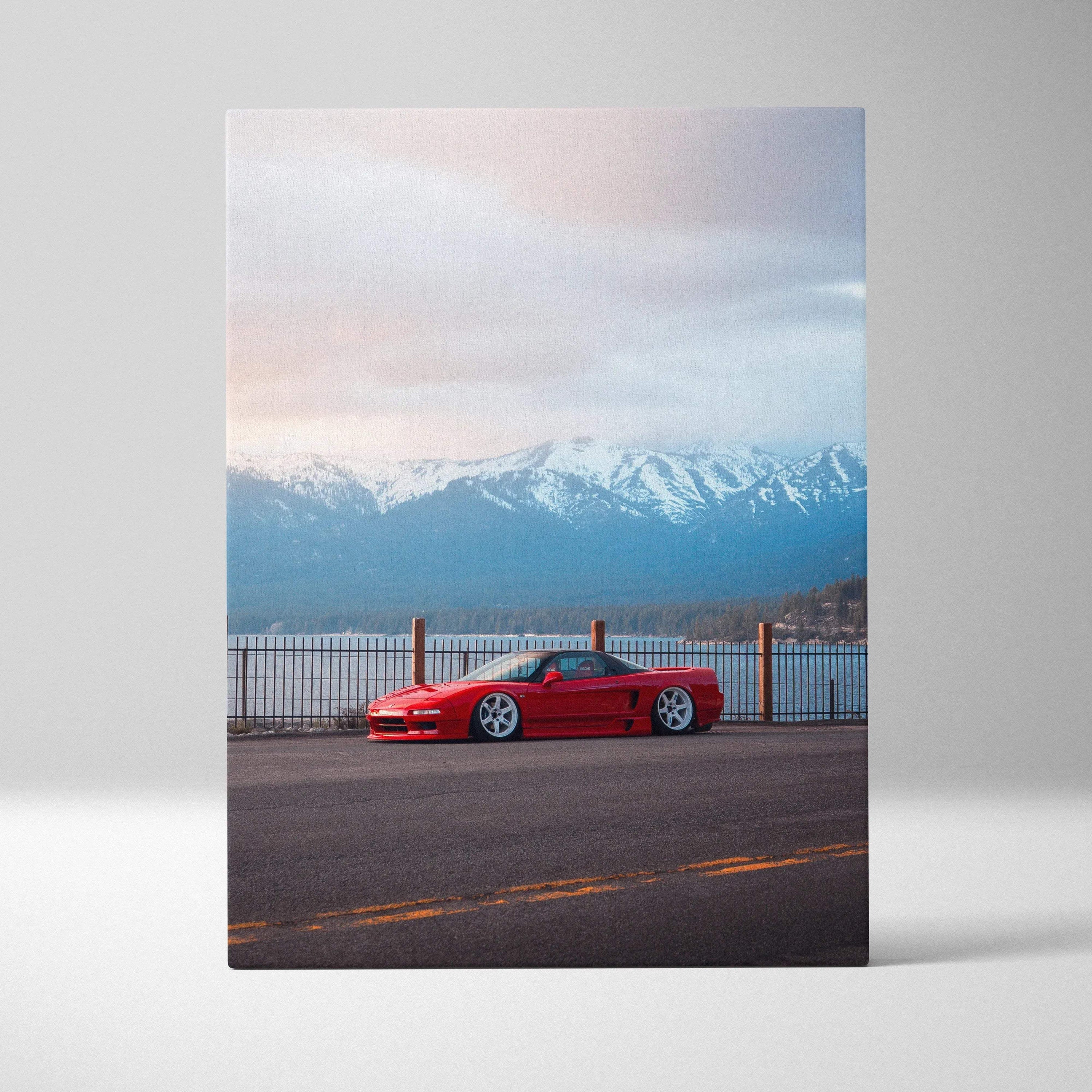 Vertical canvas wall art featuring a red Acura NSX against a sunset sky and snow-capped mountains.