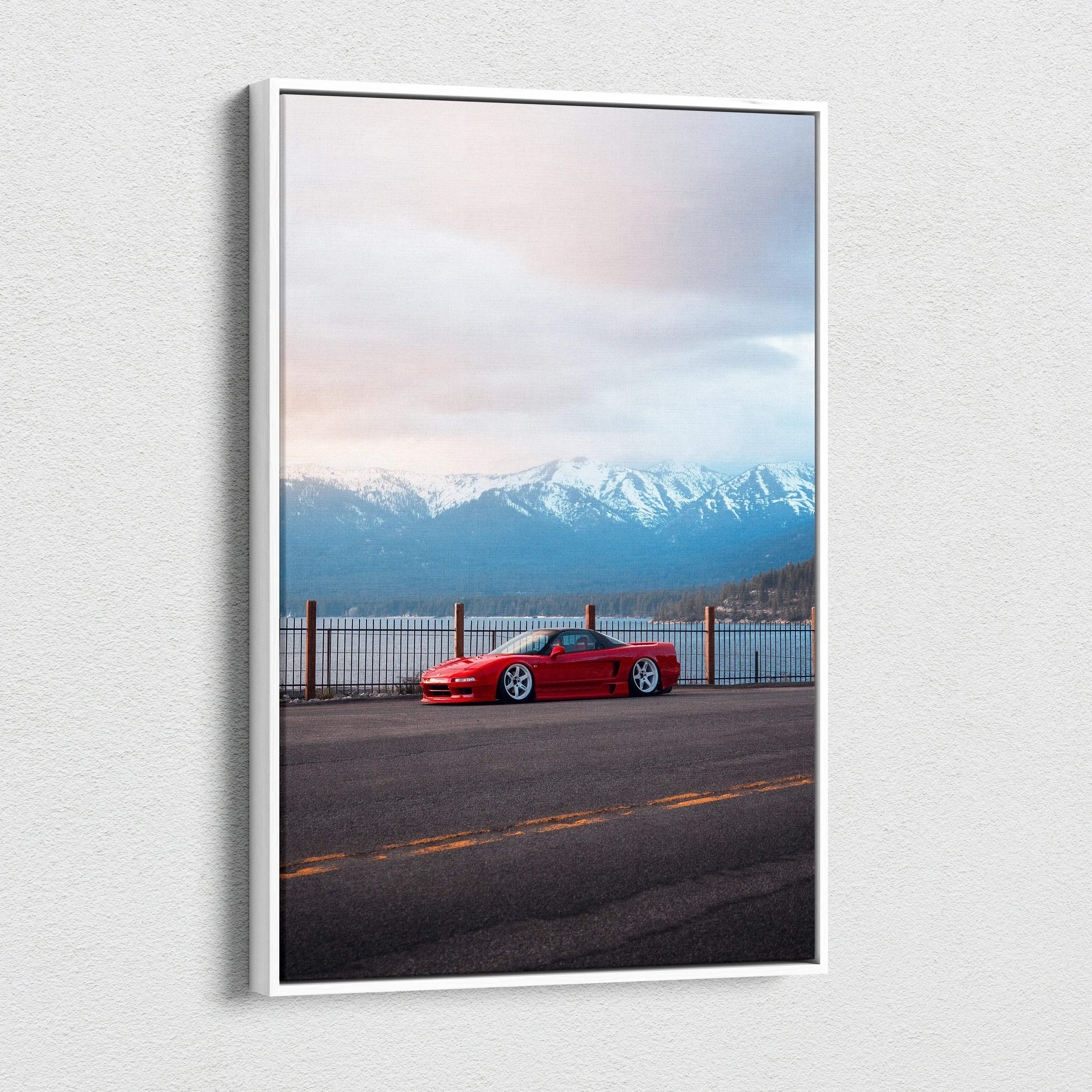 Vertical canvas wall art featuring a red Acura NSX parked by a lakeside with mountains at sunset.