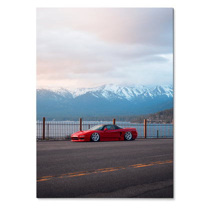 Acura NSX red sports car parked by waterfront with snowy mountains under cloudy sunset sky poster wall art.