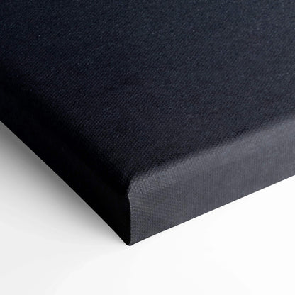 Close-up of black stretched canvas corner showcasing texture and clean edges for wall art.