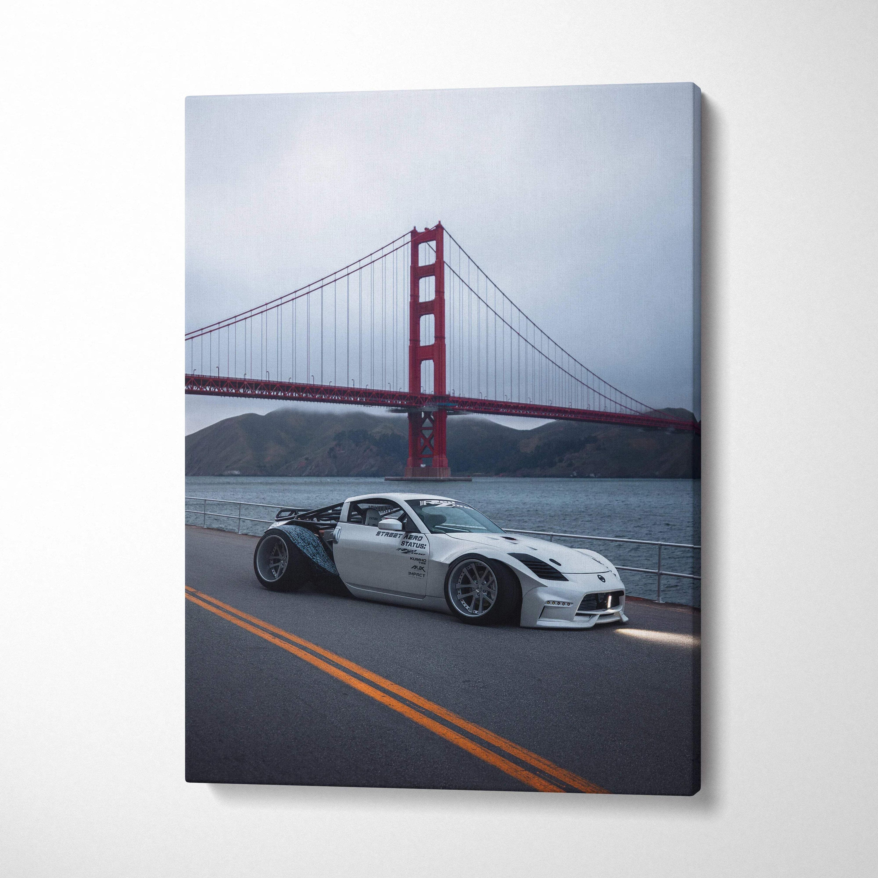 Nissan 350z car in front of Golden Gate Bridge canvas wall art with muted sky background.