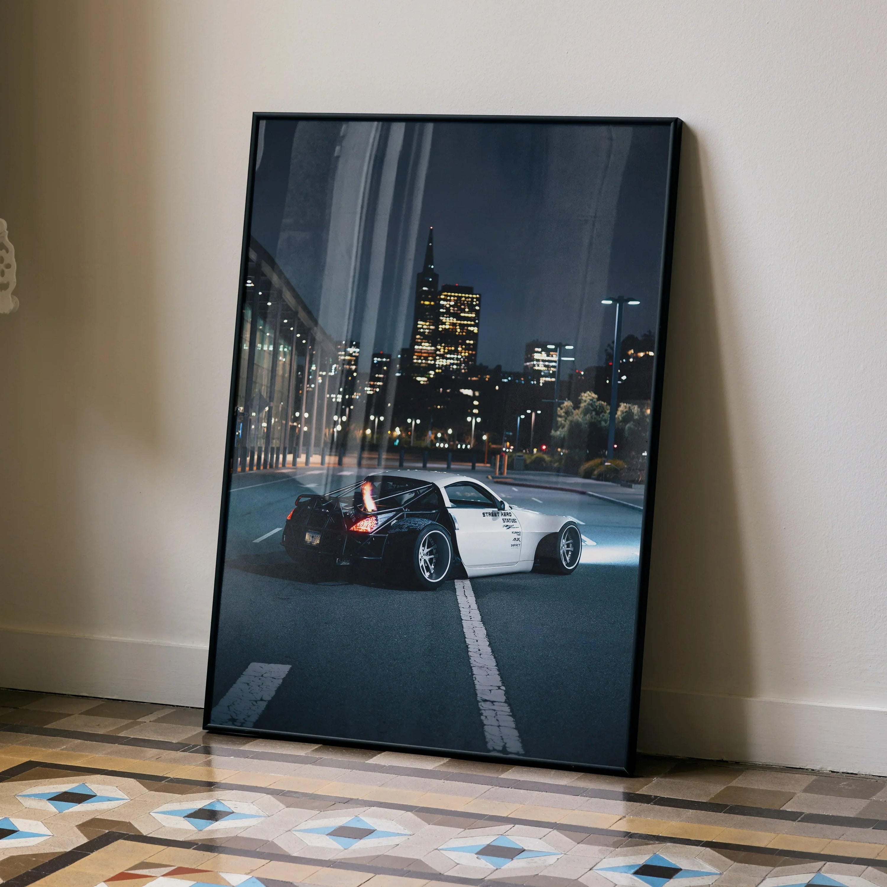 Nissan 350z JDM widebody car wall art poster with city skyline at night in black frame.