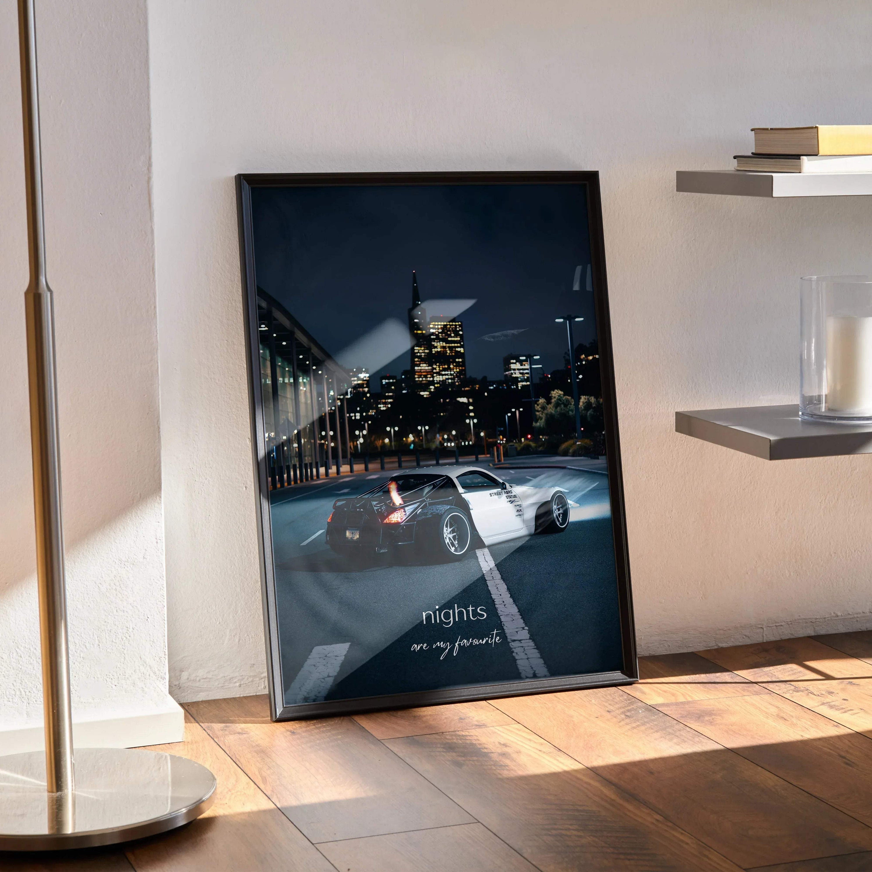 Nissan 350z poster with night cityscape and inspiring motivational text wall art in black frame.