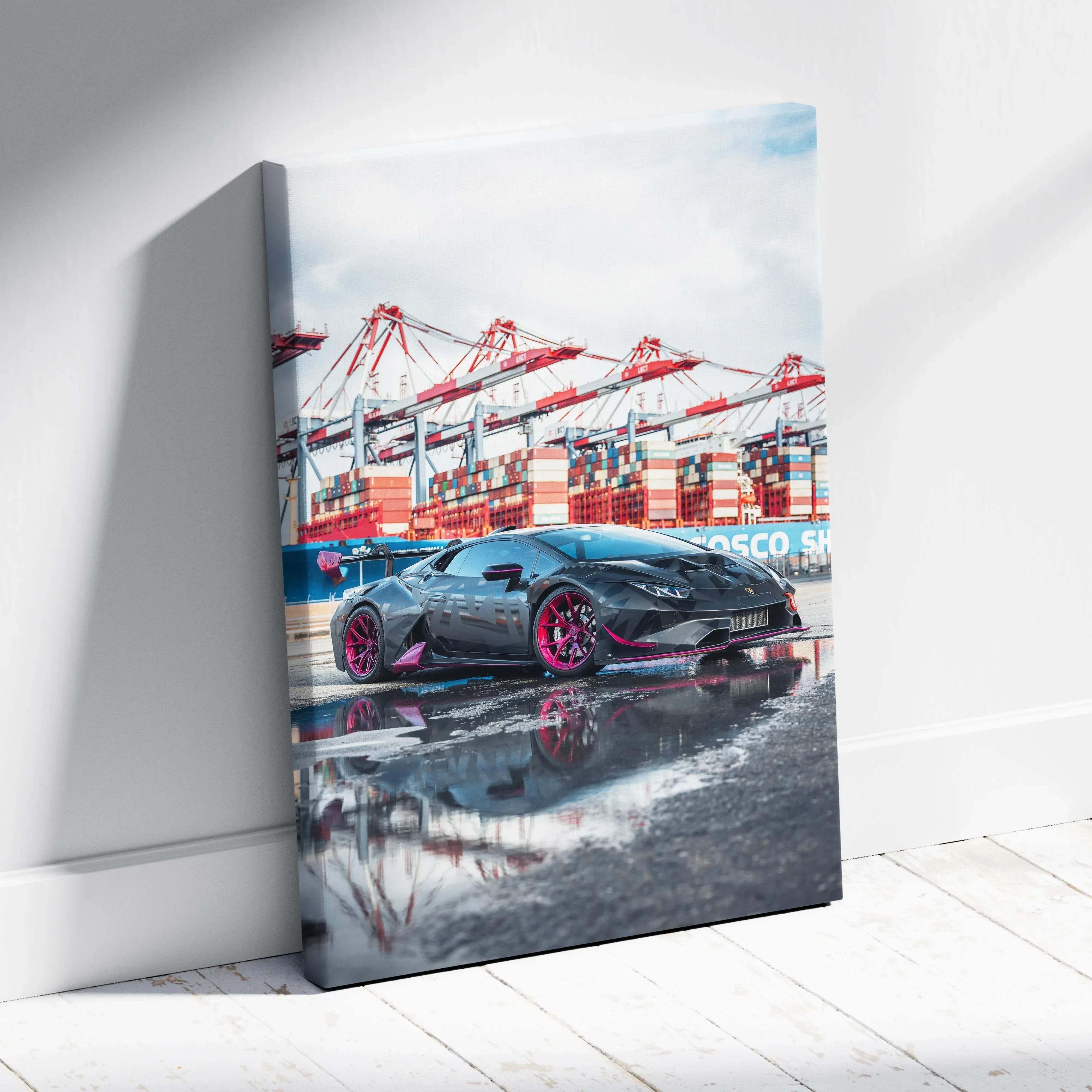 Canvas wall art Lamborghini Huracan vertical print featuring black car with vibrant pink wheels on reflective wet pavement