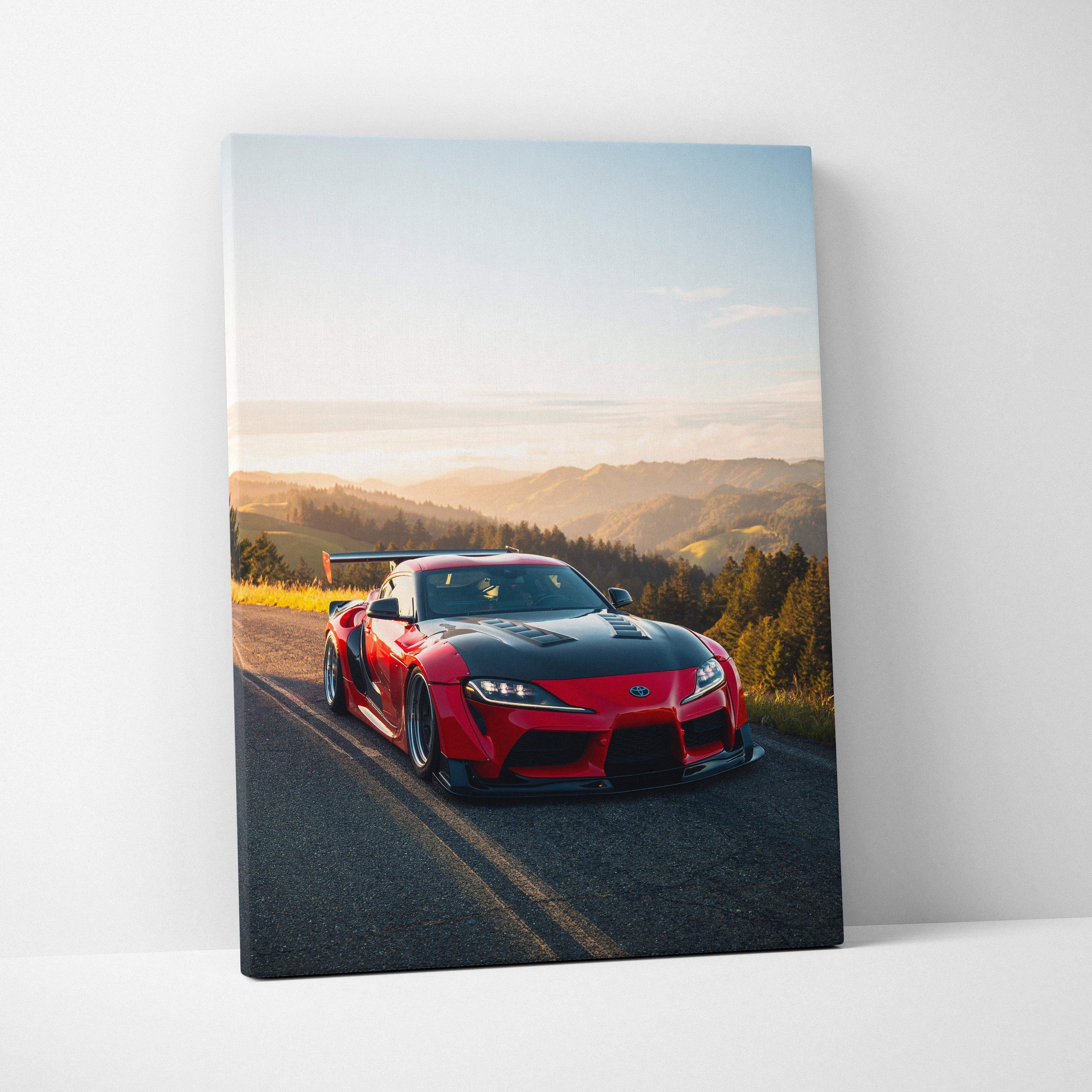 Red Toyota Supra MK5 on winding road at sunset canvas wall art in vertical format.