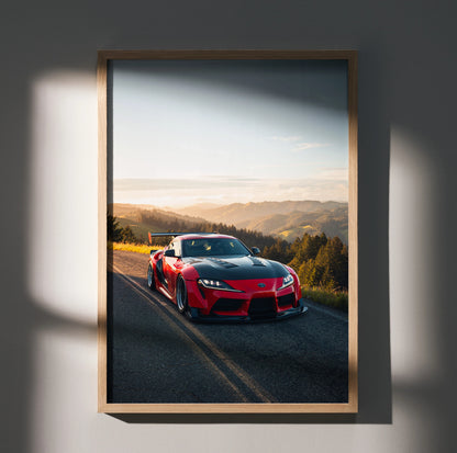 Toyota Supra Mk5 poster with red sports car on road at sunset, premium satin wall art.
