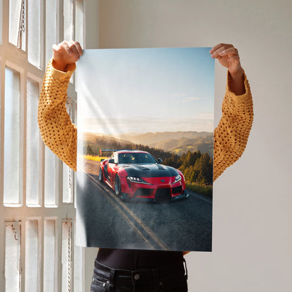Toyota Supra Mk5 red sports car driving on sunset road poster wall art.