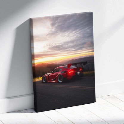Red Toyota Supra MK5 on road at sunset with dramatic clouds on vertical canvas wall art.