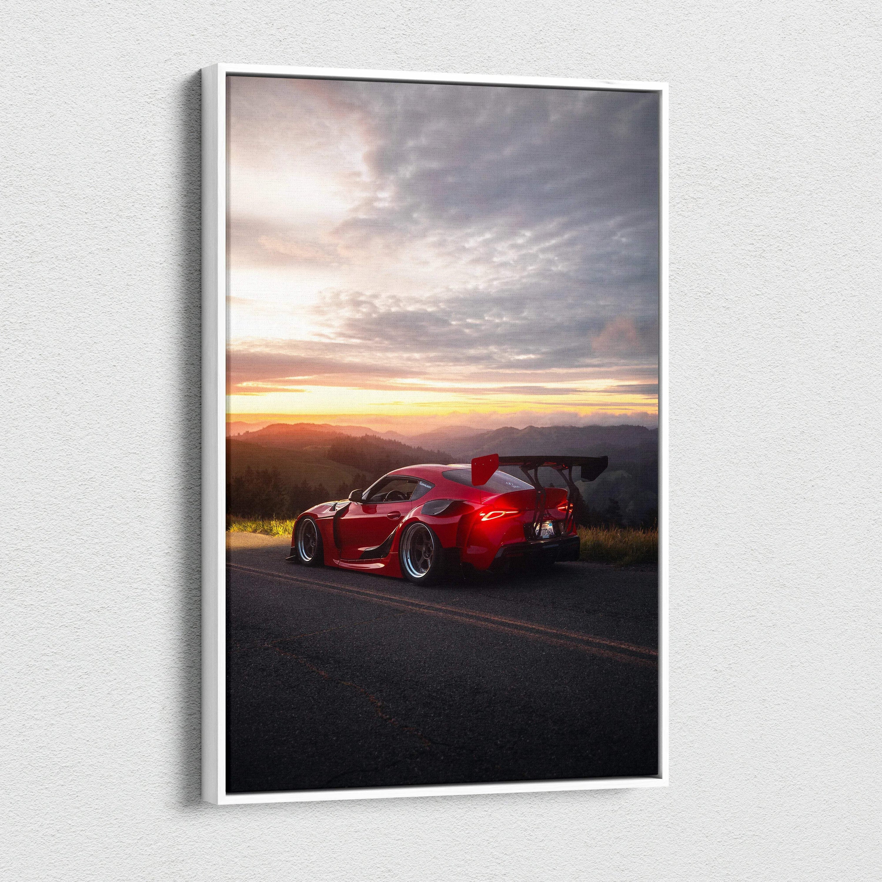 Red Toyota Supra MK5 parked on road at sunset with dramatic sky vertical canvas wall art.