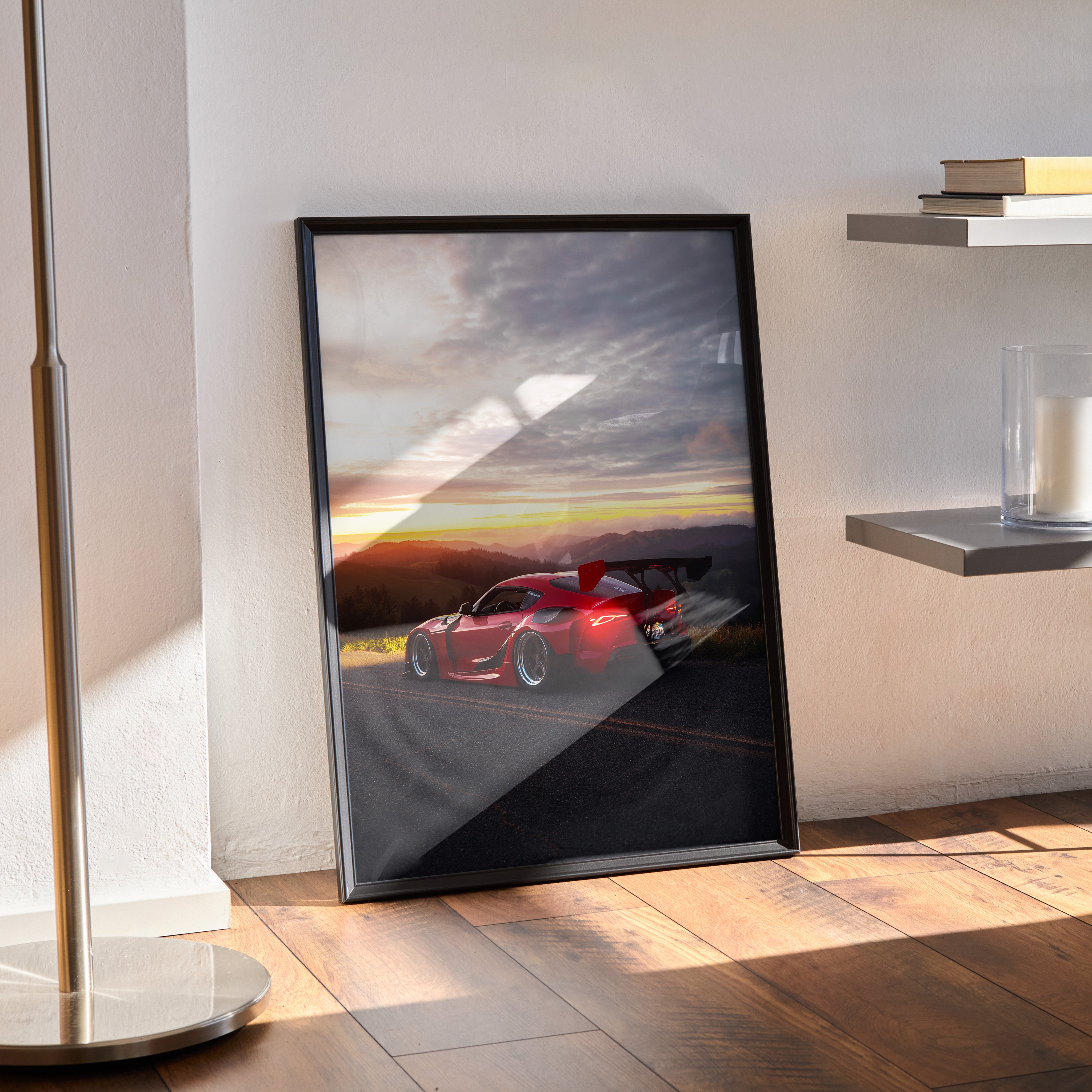 Toyota Supra Mk5 poster featuring sleek red sports car at sunset, premium wall art in black frame.
