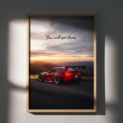 Motivational wall art poster featuring red Toyota Supra Mk5 on road at sunset with "You will get there" text.