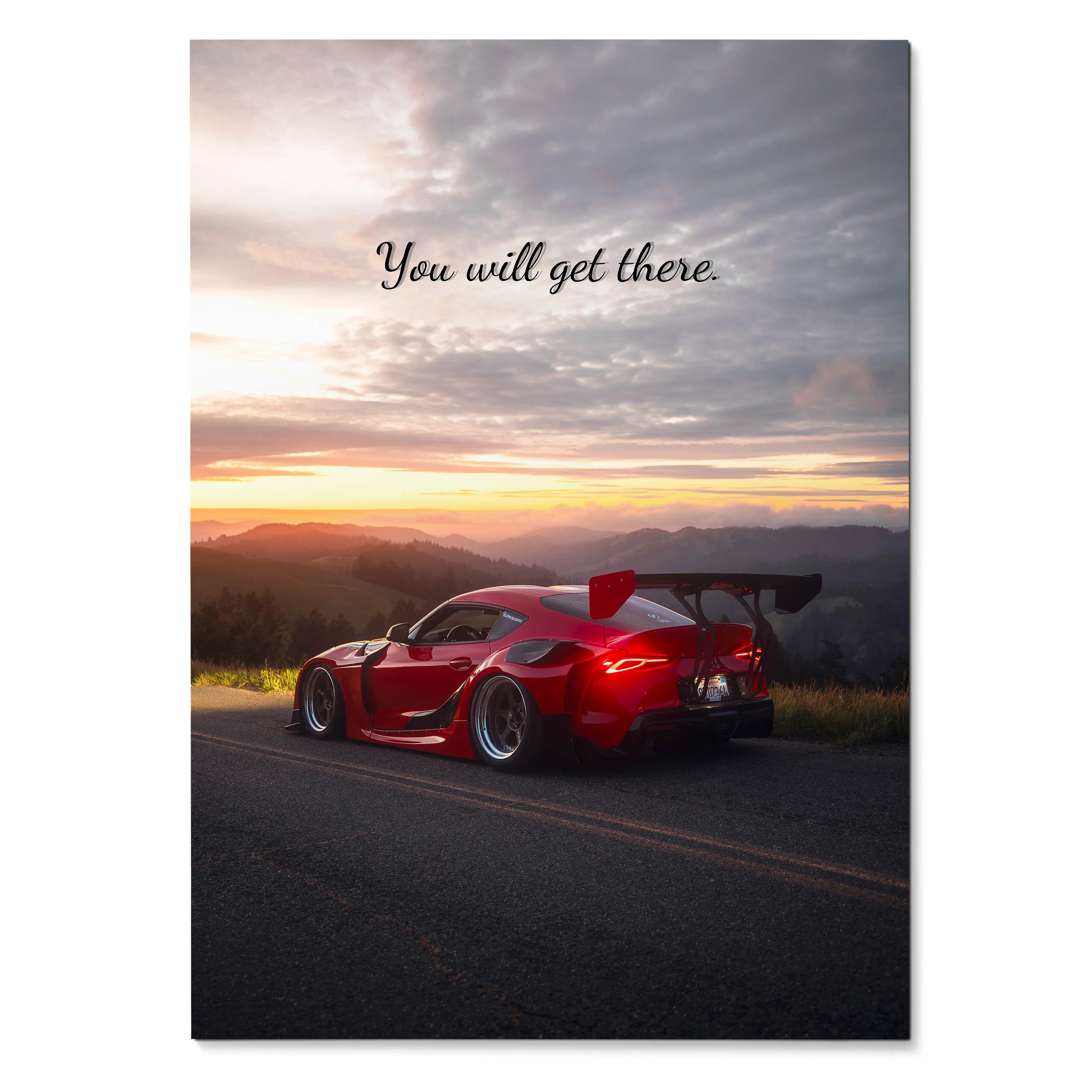 Poster of red Toyota Supra Mk5 on road at sunset with inspiring text "You will get there" and dramatic sky wall art.