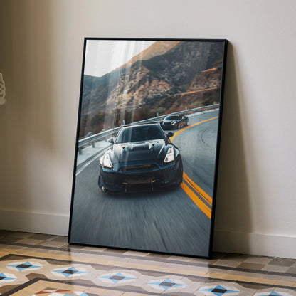 Nissan GTR R35 widebody speeding on mountain road poster wall art with black frame.