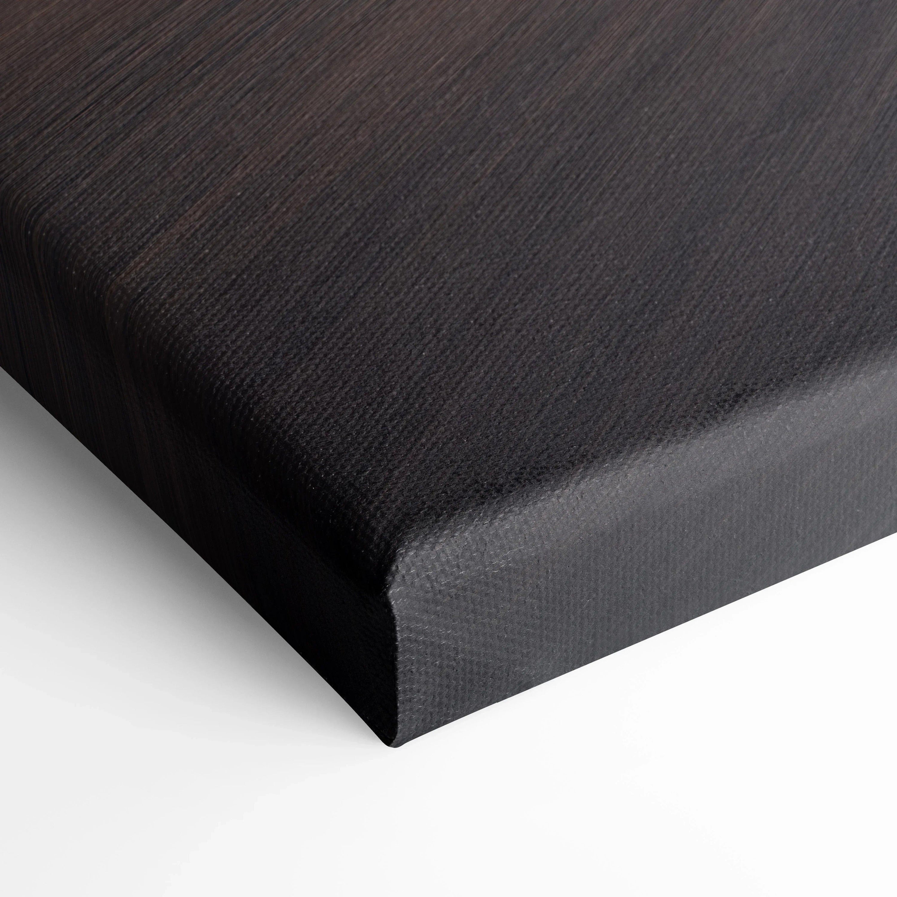 Black textured canvas corner detail showing tight corner wrap for high-quality wall art canvas print.