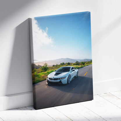 BMW i8 driving on road canvas wall art with bright blue sky vertical canvas print.