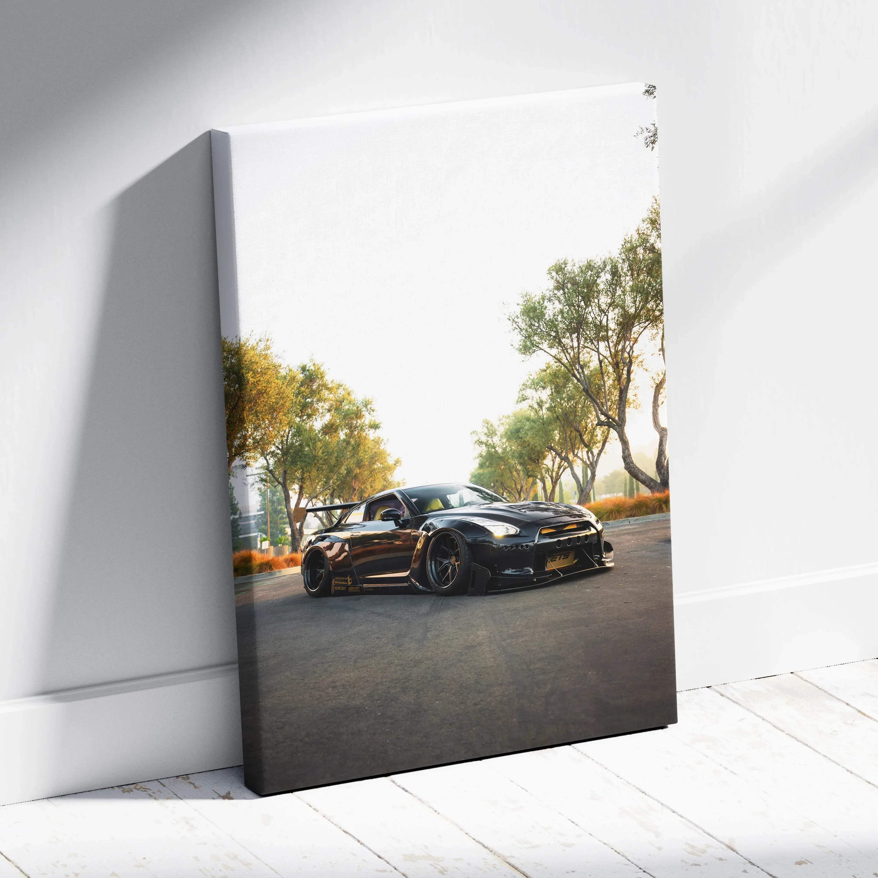 Nissan GTR R35 black sports car on road canvas wall art with trees background.