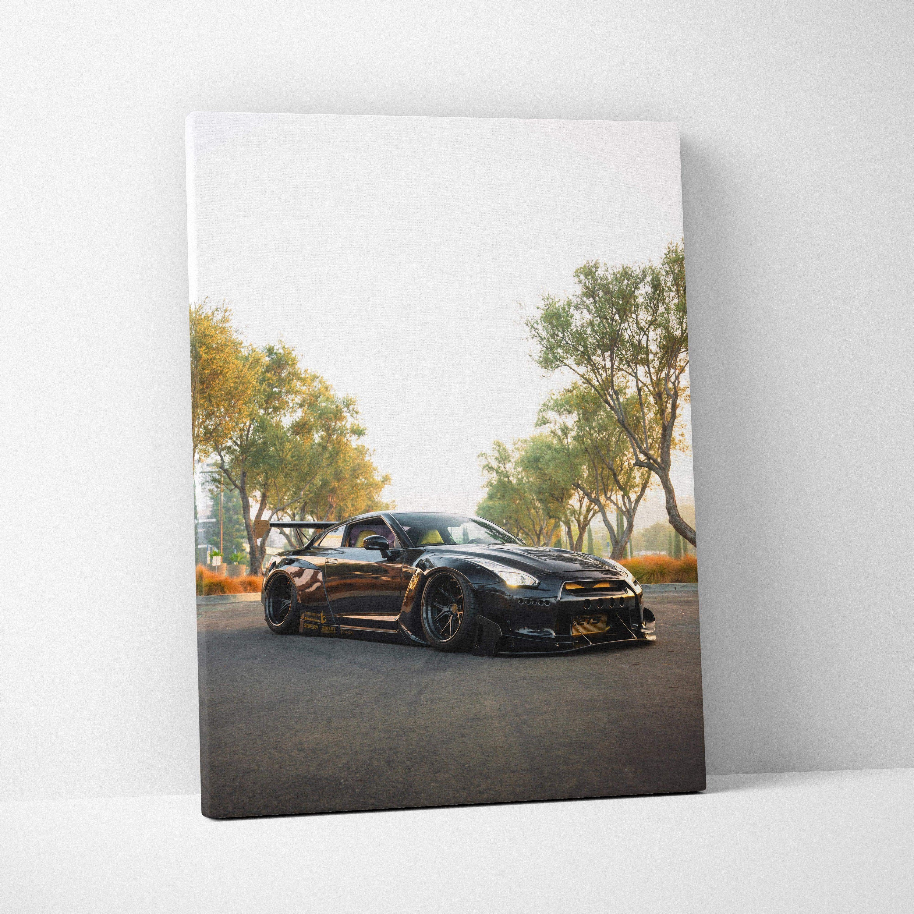 Nissan GTR R35 black sports car on road under trees vertical canvas wall art.