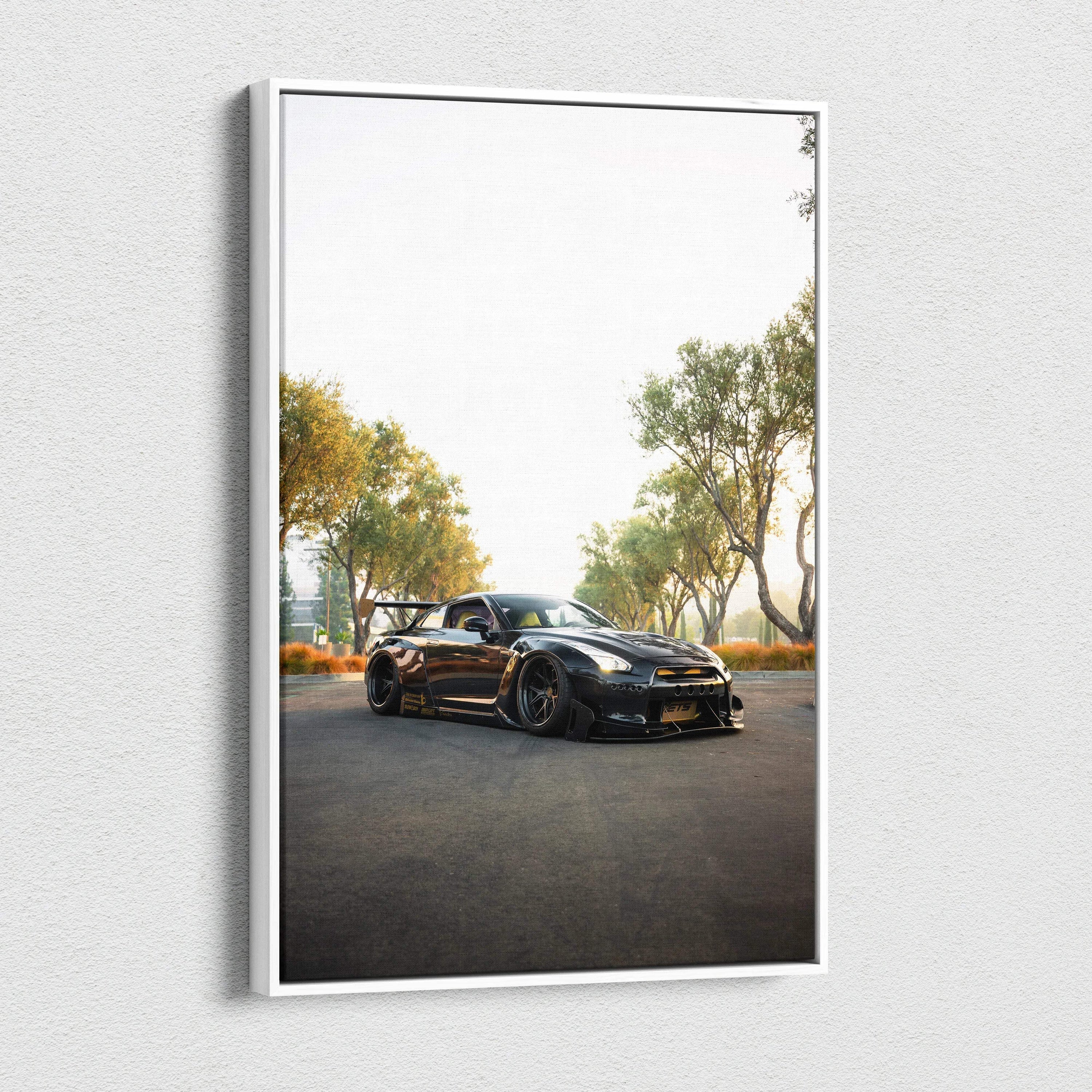 Nissan GTR R35 black sports car on road under trees vertical canvas wall art.