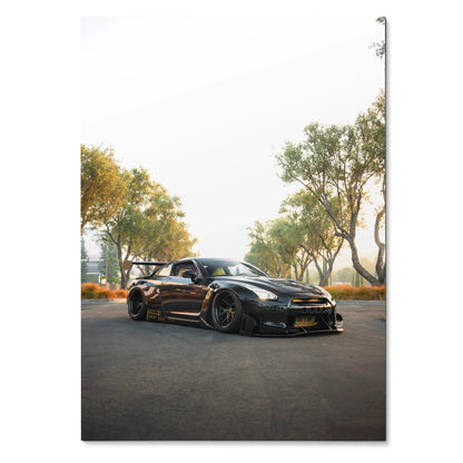Nissan GT-R R35 black sports car parked on road under trees poster wall art.