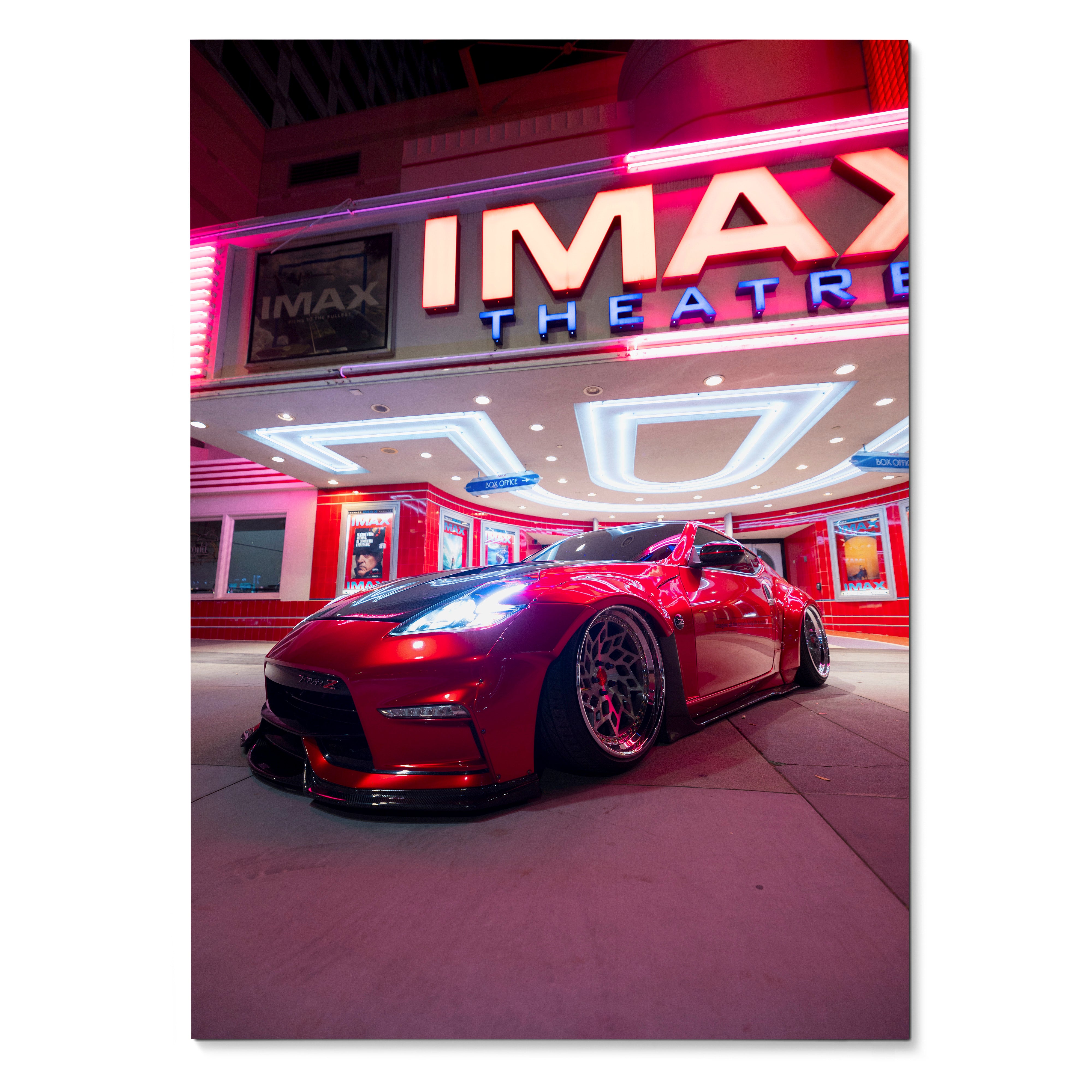 Nissan 370z poster with red sports car under neon-lit IMAX theater, stylish wall art.