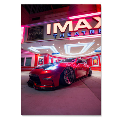 Nissan 370z poster with red sports car under neon-lit IMAX theater, stylish wall art.