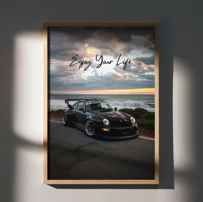 Motivational poster wall art featuring black RWB Porsche 911 with "Enjoy Your Life" text against sunset sky background.