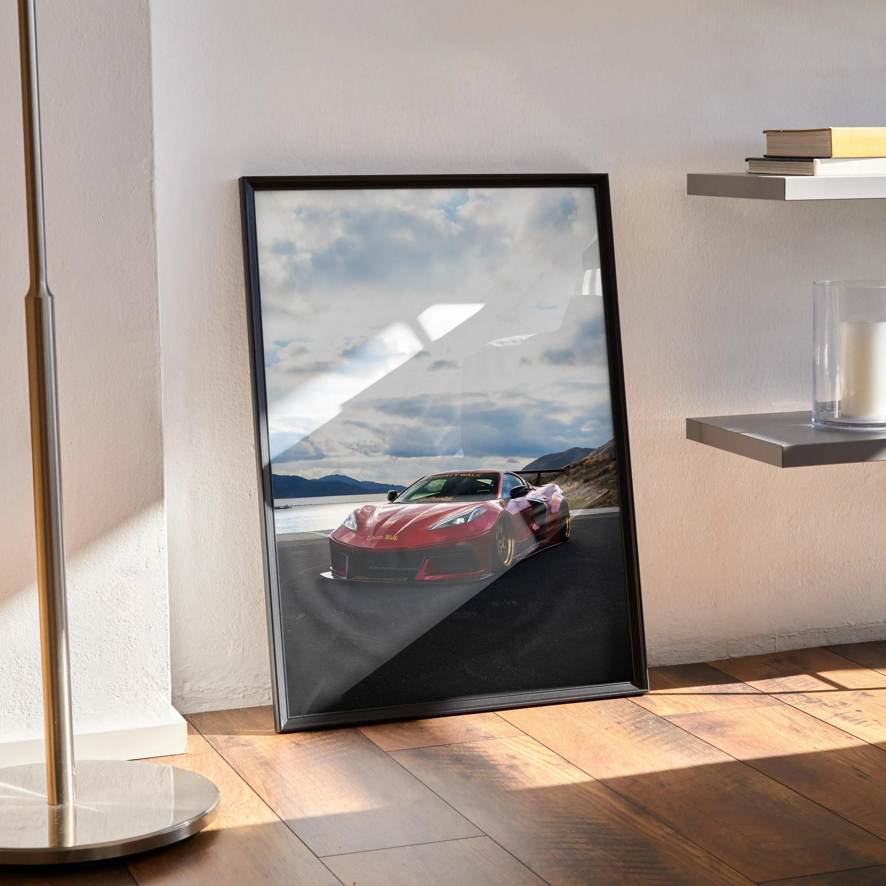 C8 Corvette poster wall art with red sports car on scenic mountain road in black frame.