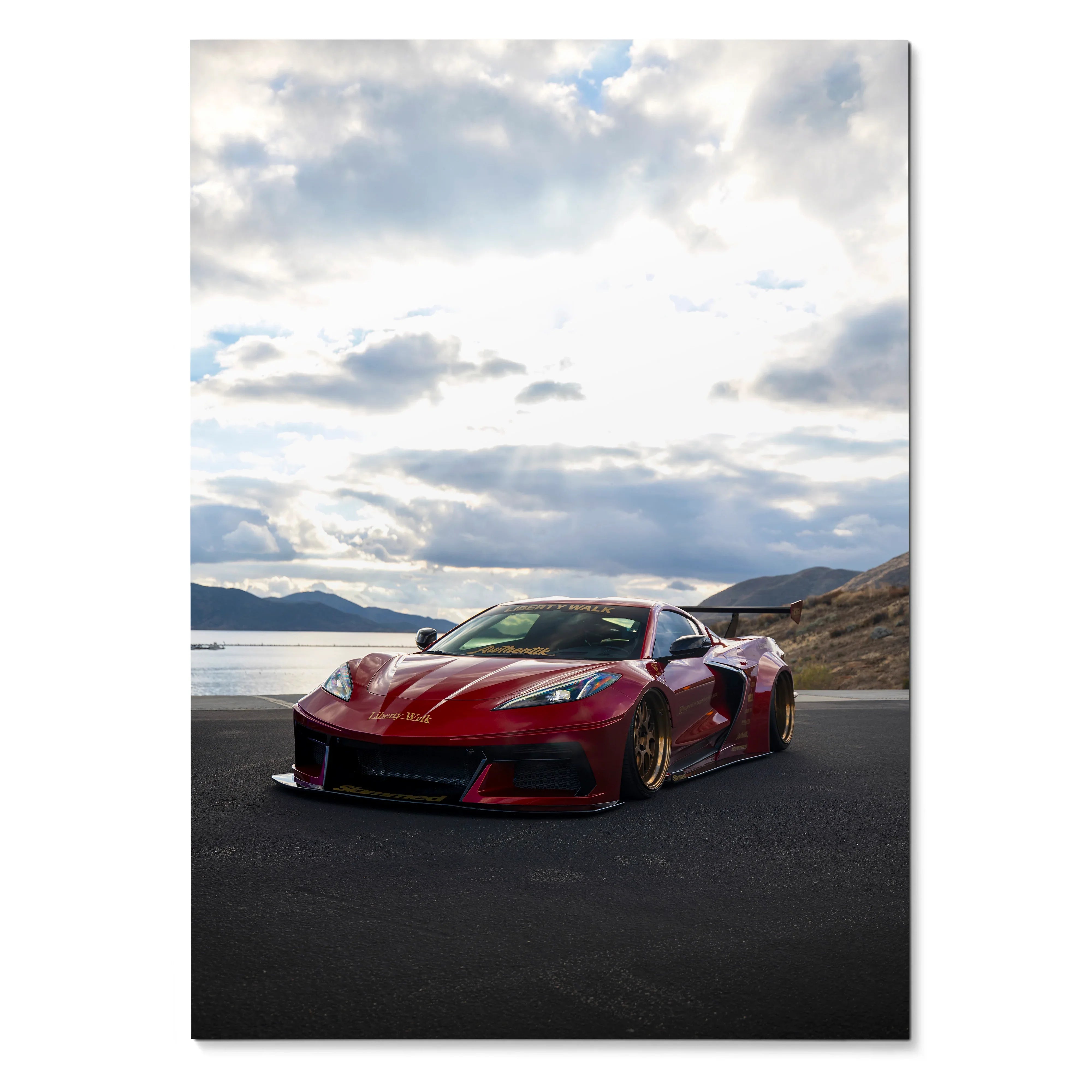 C8 Corvette red sports car on asphalt with cloudy sky premium satin poster wall art.