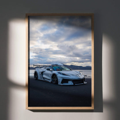 Chevrolet C8 Corvette white sports car on coastal road poster wall art in wooden frame.