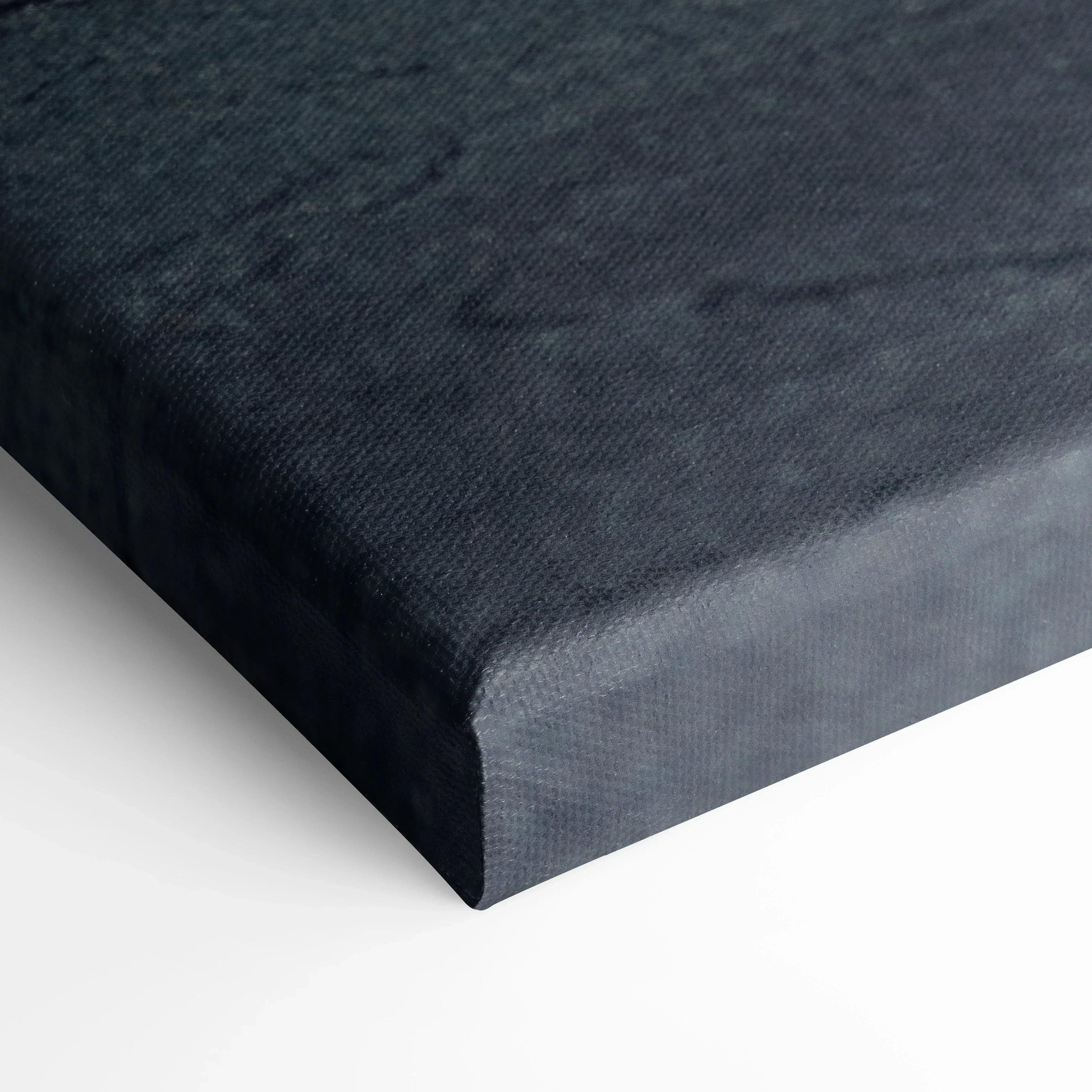 Close-up of black textured canvas art with a deep gallery wrap edge for wall art display.