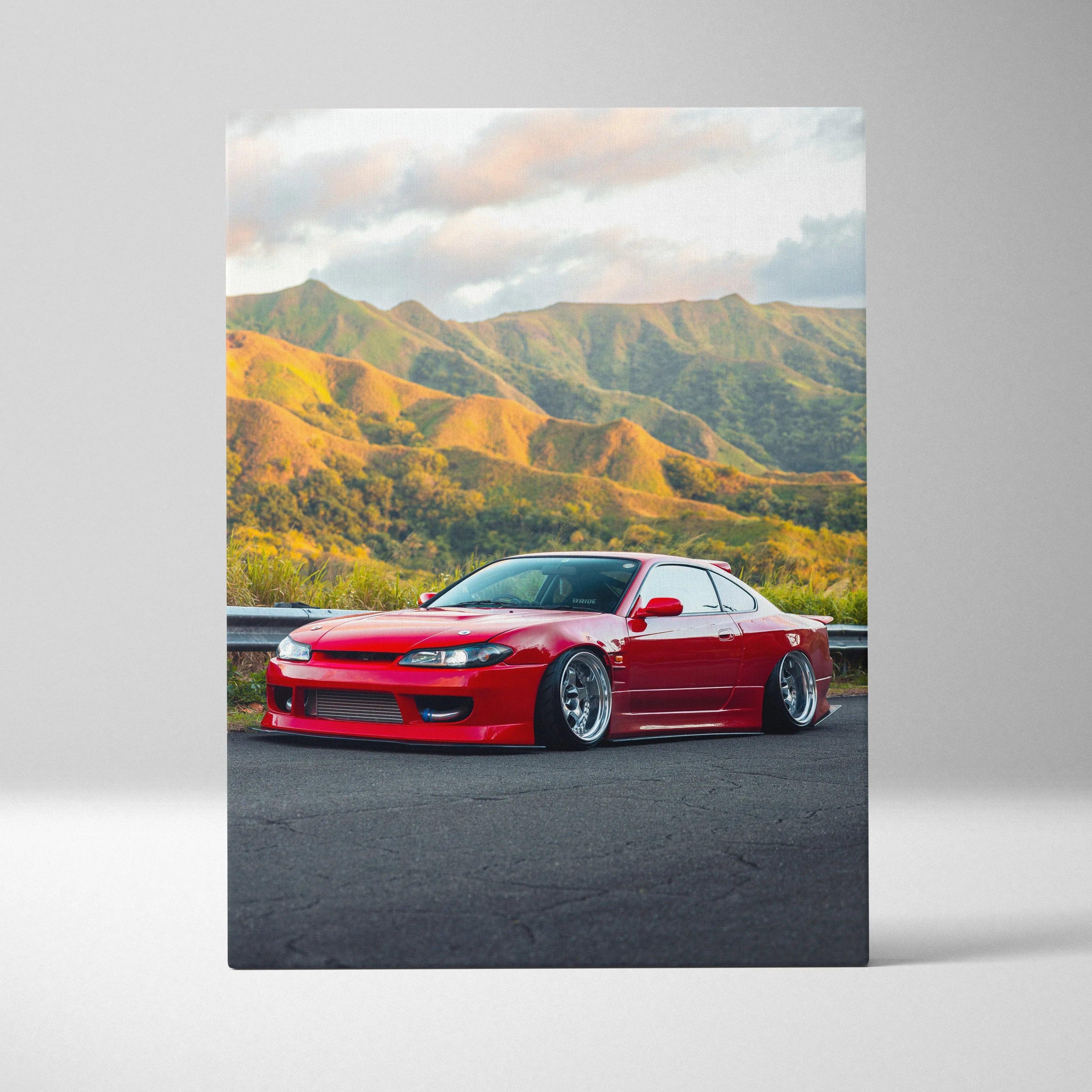 Red Nissan S15 Silvia car with lowered stance on canvas wall art featuring scenic mountain background.