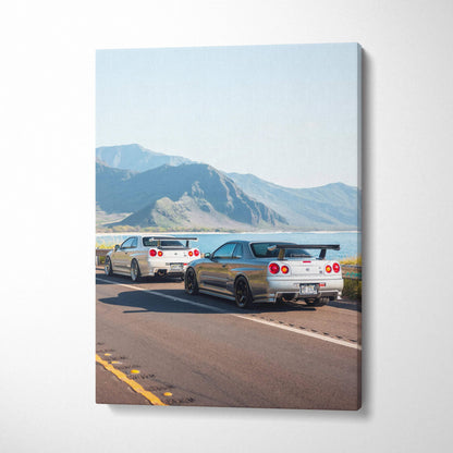 Vertical canvas art featuring two Nissan R34 GTR skylines driving on an open road with mountains in the background.