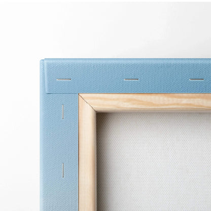 Close-up of wooden frame with light blue stretched canvas for vertical wall art canvas print.