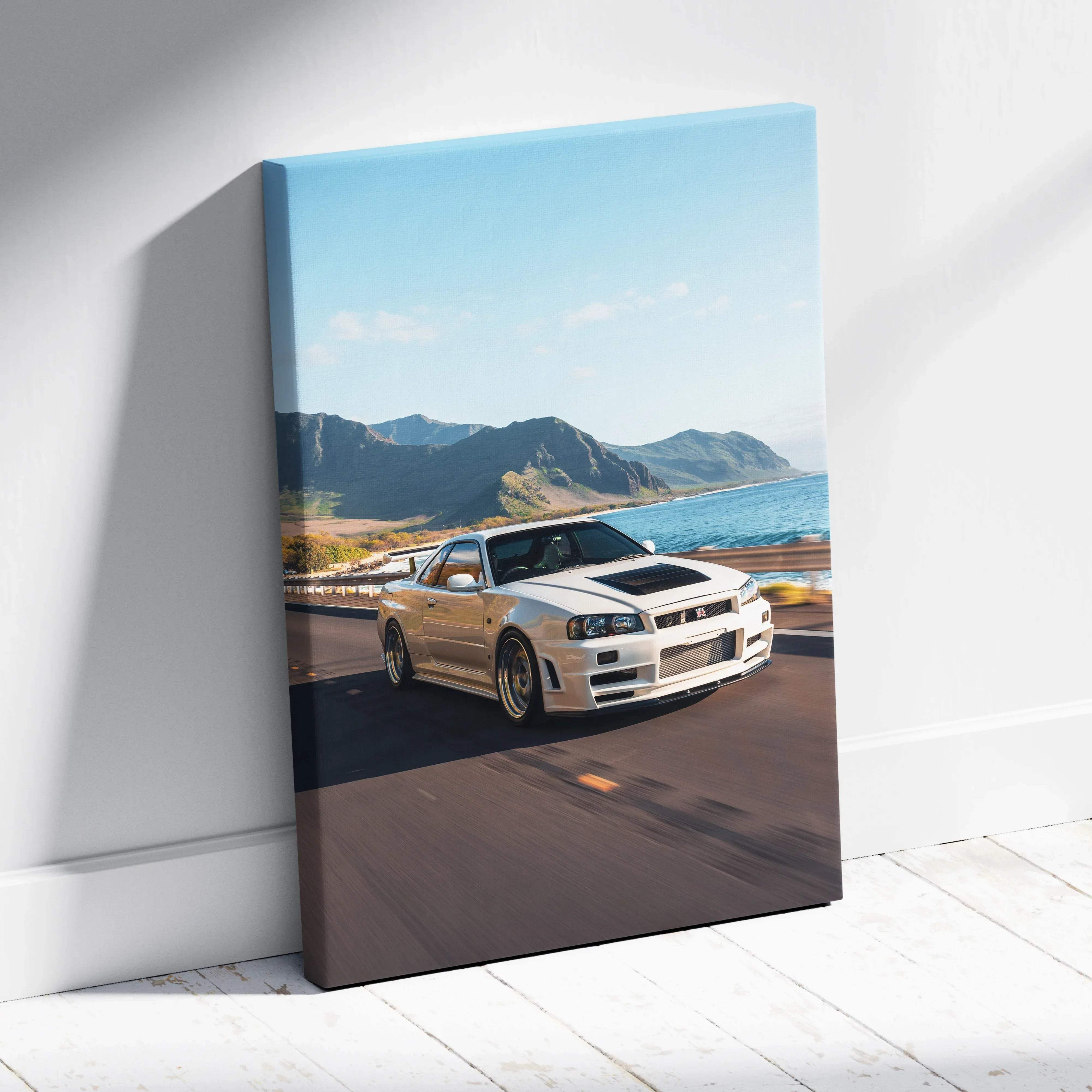 White nissan skyline r34 gt-r canvas wall art showing a high-performance sports car speeding on a coastal road