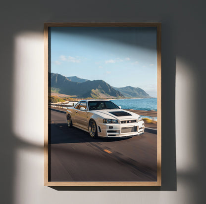 Nissan GT-R R34 Skyline driving along coastal road with mountains background poster wall art.