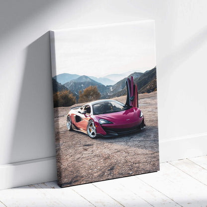 Vertical canvas art of a red McLaren 600LT with open butterfly door on mountain road wall art.