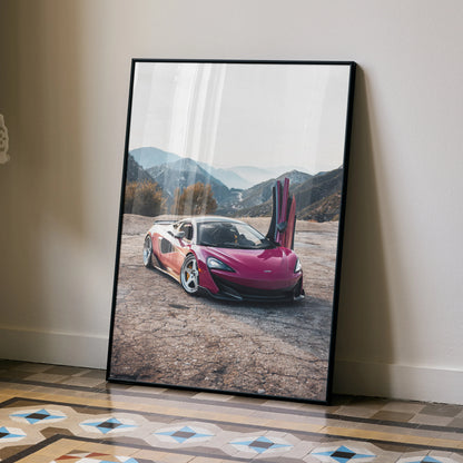 McLaren 600LT poster with butterfly doors open in mountain landscape, wall art in black frame.