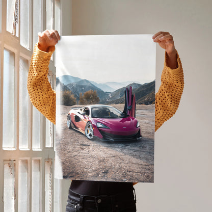 McLaren 600LT with open doors on mountain road poster wall art in vibrant colors.