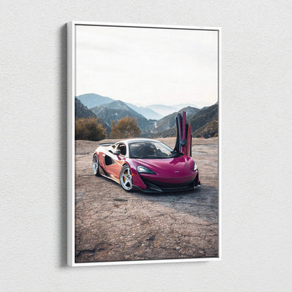 Vertical canvas wall art of a pink McLaren 600LT with open door on a mountain road, high-resolution canvas art.