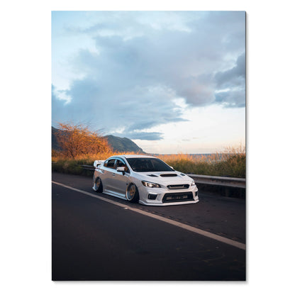 Slammed white Subaru WRX on asphalt road under cloudy sky poster wall art.