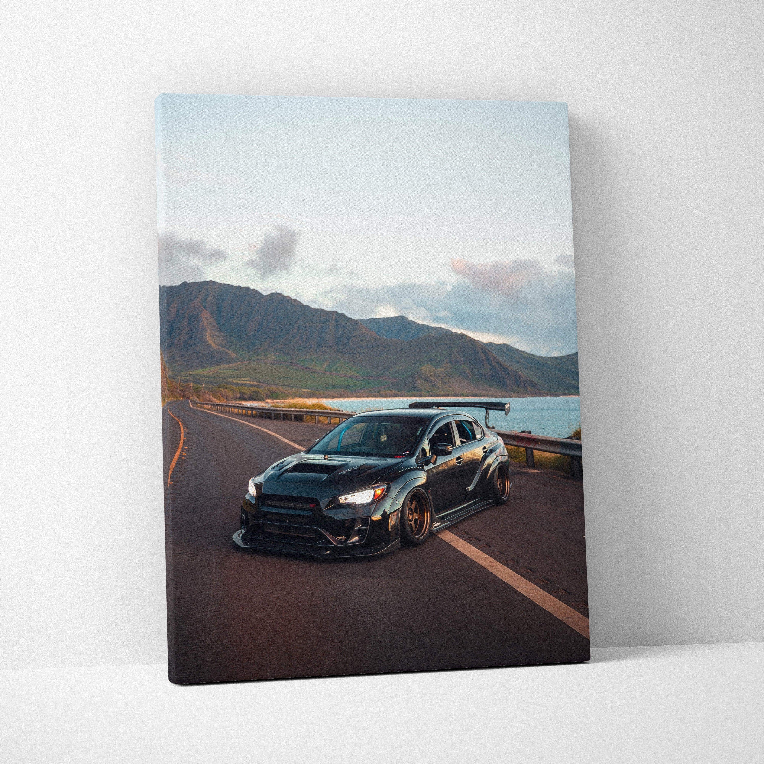 Subaru WRX STI driving on coastal road at sunset canvas wall art vertical canvas art print.